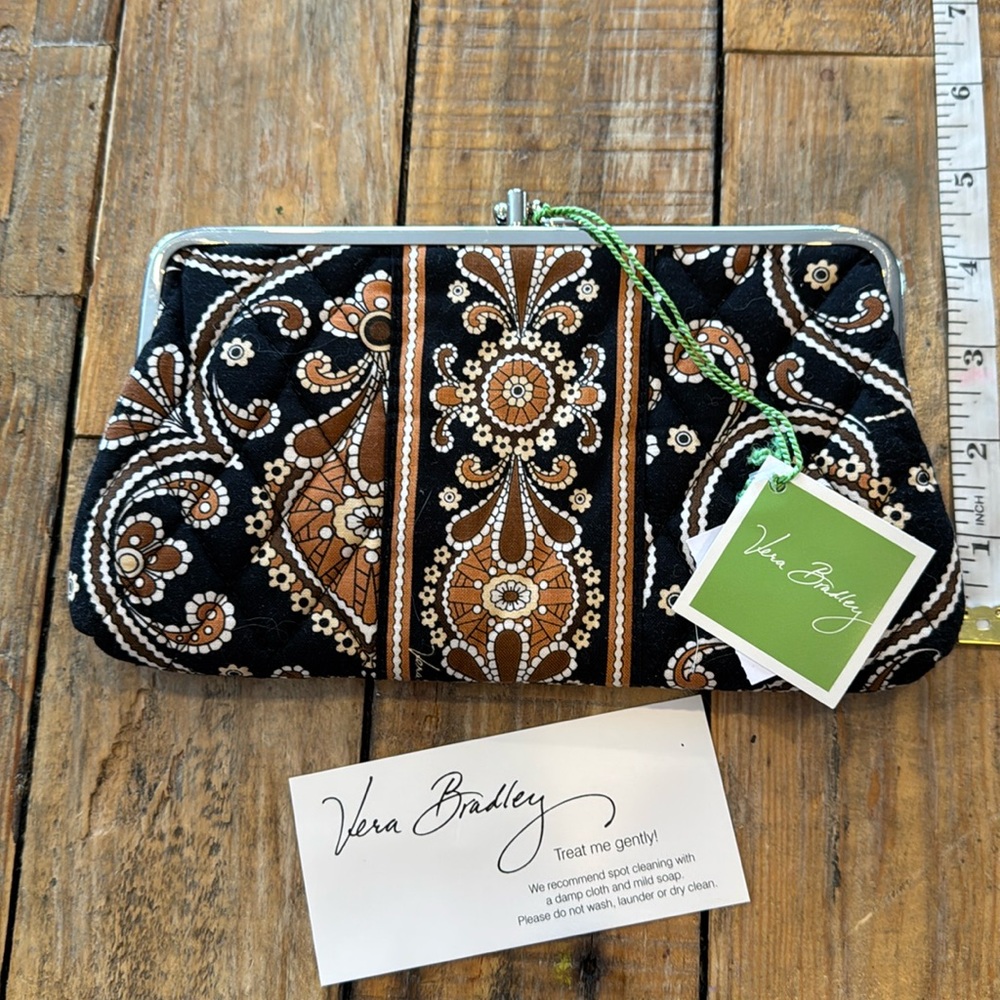 Vera Bradley cloth clutch with two wallet sections.